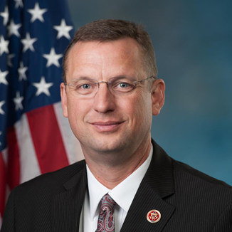 https://amchamcolombia.co/wp-content/uploads/2025/01/Doug-Collins.png